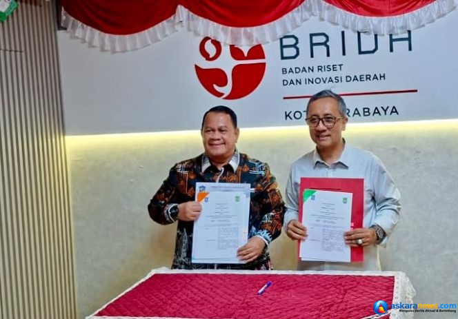 
 Kepala BRIDA Kota Batam, Efrius, bersama Kepala BRIDA Kota Surabaya, Agus Imam Sonhaji, menandatangani PKS bersama di Kantor BRIDA Kota Surabaya, Kamis (24/9/2026). 